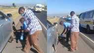 Police officer shows kindness as he helps stranded motorist change flat tyre, heartwarming photos go viral