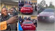 Rich Nigerian man takes CLA 45 AMG Benz worth over N42m to UNILAG, clip shows students "rushing" him