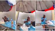 Young man stuns old roadside seller with N5k in video after buying N100 popcorn, it's her cute smile for many