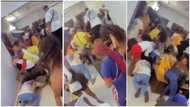 Slay queens fight over money sprayed at house party as they rush to pick it, one loses her wig in video