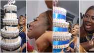 Adediwura Gold bursts into tears as friend surprises her with wads of cash and huge money cake on her birthday