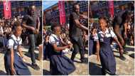 Cute school kid with flexible body takes on Usain Bolt in marathon dance, twists her body like robot in video