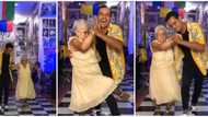 Old woman drops walking aid, busts legworks as she dances with young man, video goes viral