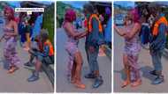 "Is he your dad?" Confident lady in tight-fitting gown dances for old man in public, video goes viral