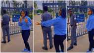 "I think I'm crushing on him": Nigerian lady dances behind security man, pretends after being caught in video