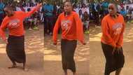 Confident young girl in long skirt dances powerfully in the midst of large crowd, TikTok video goes viral