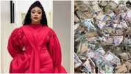 Actress Mimi Orjiekwe flaunts huge pile of dollar and naira notes sprayed at her birthday party