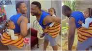 Nigerian man ties baby on his back during babysitting, dances in a sweet way as video goes viral on TikTok