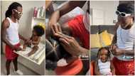 Lovely father bathes his baby daughter, plaits her natural hair into cornrows like professional hairdresser