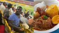 Fan spotted eating swallow and Okro soup inside stadium while watching a live football match