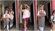 Mum dances with joy as 3 kids resume school after long break, they carry bags, wear white socks