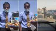 Young Nigerian man with suits and tie hawks kola nuts, sweets in Abuja traffic, his video goes viral