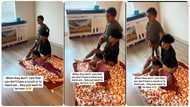 Young children visit aunty who moves to house without furniture, sit comfortably on the bare floor