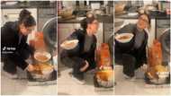 "Bride price has gone up": Video shows moment oyinbo lady squatted to serve people hot jollof rice in kitchen