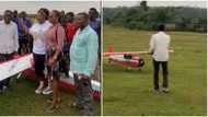 Lady flies in from UK, storms village to meet talented Nigerian man who built mini-aeroplane, video goes viral
