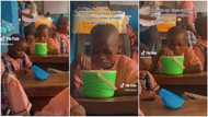 Video of Nigerian kid drinking garri from his cooler and enjoying it like jollof rice stirs reactions
