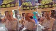 Naira scarcity: Nigerian apple hawker allows customers to transfer, charges them more to make quick profits