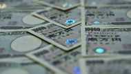 Asian markets drop after Wall St loss, yen rises ahead of BoJ