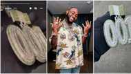 Davido splurges millions on heavily studded number 001 diamond pendant, Wizkid fans react online
