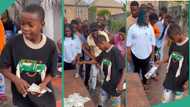 Young boy participating in bottle flip challenge emerges champion, wins money in public