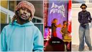 Asake makes money rain on lookalike who joined him on stage at a concert, video excites many