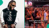 Burna Boy: Oyinbo fans dance choreography in the crowd as he sings on stage, "See how happy dey are”