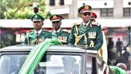 Photos emerge as Buhari arrives army parade in military apparel