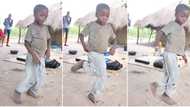 Young boy in blue trouser dances with fast legs in front of thatched house, sweet video goes viral on TikTok