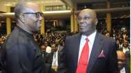 Peter Obi attempts to kneel while greeting Atiku Abubakar at NBA conference
