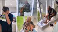 Omashola’s oyinbo fiancée gets emotional as BBN star’s mother bathes their newborn son the African way