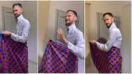 "She don spoil the oyinbo finish": White man ties wrapper, acts like Nigerian wife after she bathes