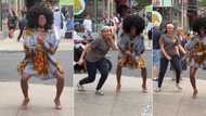 "She caught the virus": Oyinbo lady joins pretty black girl in afro to dance in the streets abroad, video trends