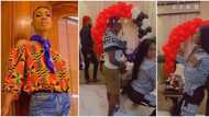 Friends rain cash on crossdresser James Brown as they celebrate his birthday