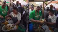 Reactions as video shows Whitemoney buying roasted yam at roadside shed in Enugu with full security team