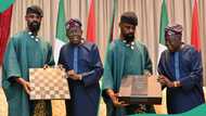 Tunde Onakoya gifts Tinubu special edition gold-plated Adire chess set, photo emerges