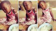 "Someone's euture wife": Baby girl sleeps off with food in her hand, battles to stay awake in viral video