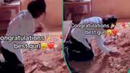 "It's not easy": Graduate visits late dad's grave after signing out, weeps and rubs sand on her body
