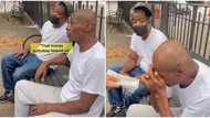 Man approaches two strangers, splashes N835k cash on them, video stuns social media users