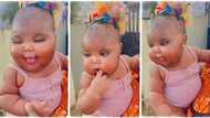 Mother steps out in streets with her amazing baby born with chubby cheeks, video goes viral