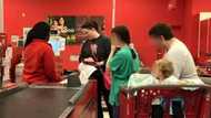 Kind woman pays for foodstuff family bought at supermarket when they started removing items during checkout