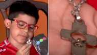 Narrow escape for 9-year-old boy as he is saved from stray bullet by a crucifix necklace he wore (see photo)