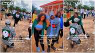 "It's the cap for me": Beautiful Nigerian lady removes her wig to celebrate in public as boyfriend proposes