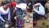 Beautiful bride kneels down and uses mouth to put small pot on fire on wedding day, TikTok video goes viral