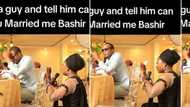 Lady proposes to man at another couple's wedding, kneels down while holding microphone, he agrees in video