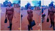 Bold lady shows off her figure in form-fitted ruched dress, internet users in awe of her confidence