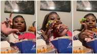 Video of lady eating chicken with extra long nails leaves internet users amused