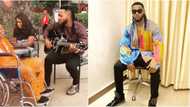 Cute video of singer Flavour playing guitar for his father in Enugu