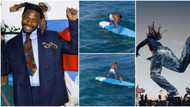 "Rough play": After pulling spider-man stunt at Afro Nation, Asake goes surfing, falls off surfboard at sea