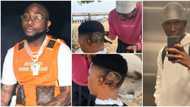 Davido reacts as talented barber carves his face on a young man's head