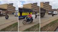 Boy walks on a big tyre on main road, many people fear he may get hit as video goes viral